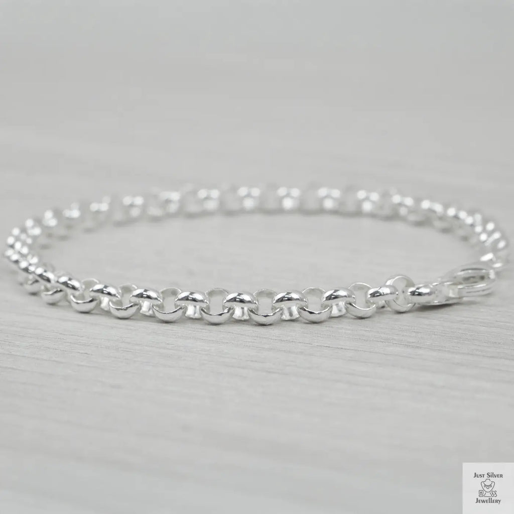 Silver bracelet on a light grey background