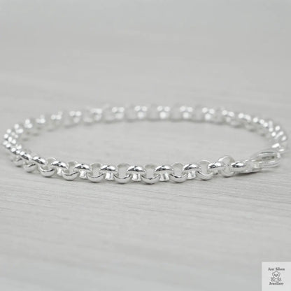 Silver bracelet on a light grey background