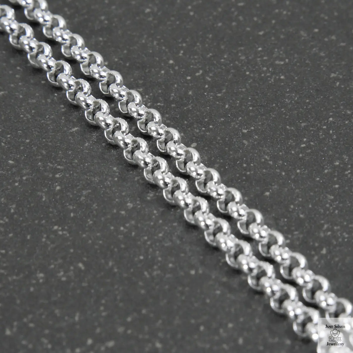 Silver beaded chain on a light gray background