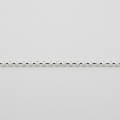 Silver beaded chain on a light gray background