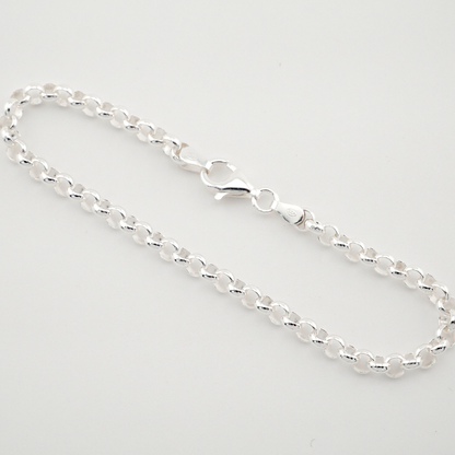 Silver chain bracelet on a light gray background