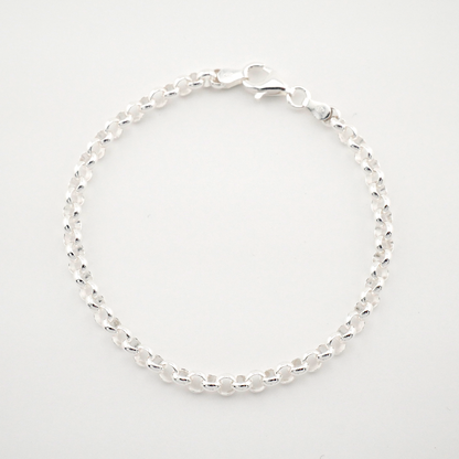 Silver beaded bracelet on a light gray background