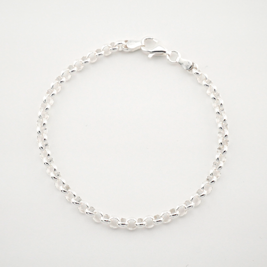 Silver beaded bracelet on a light gray background