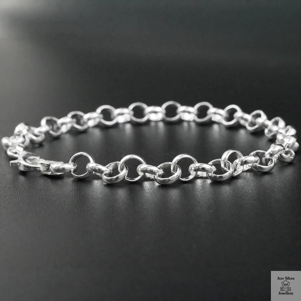 Silver chain bracelet on a black background