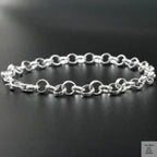 Silver chain bracelet on a black background