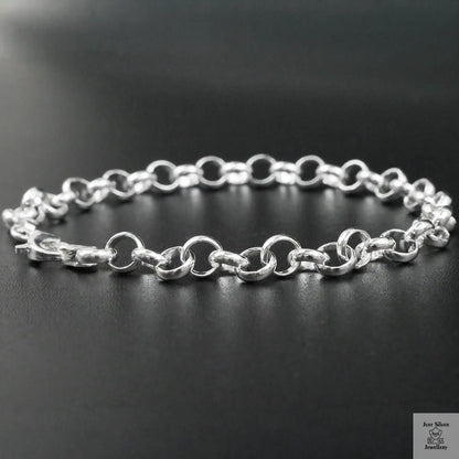 Silver chain bracelet on a black background