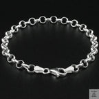 Silver chain bracelet on a black background