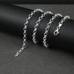 Silver Belcher/Rolo chain bracelet on a dark surface