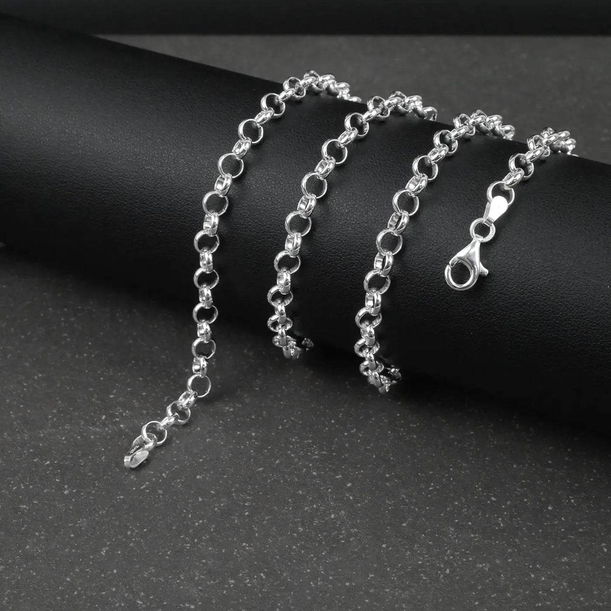 Silver Belcher/Rolo chain bracelet on a dark surface