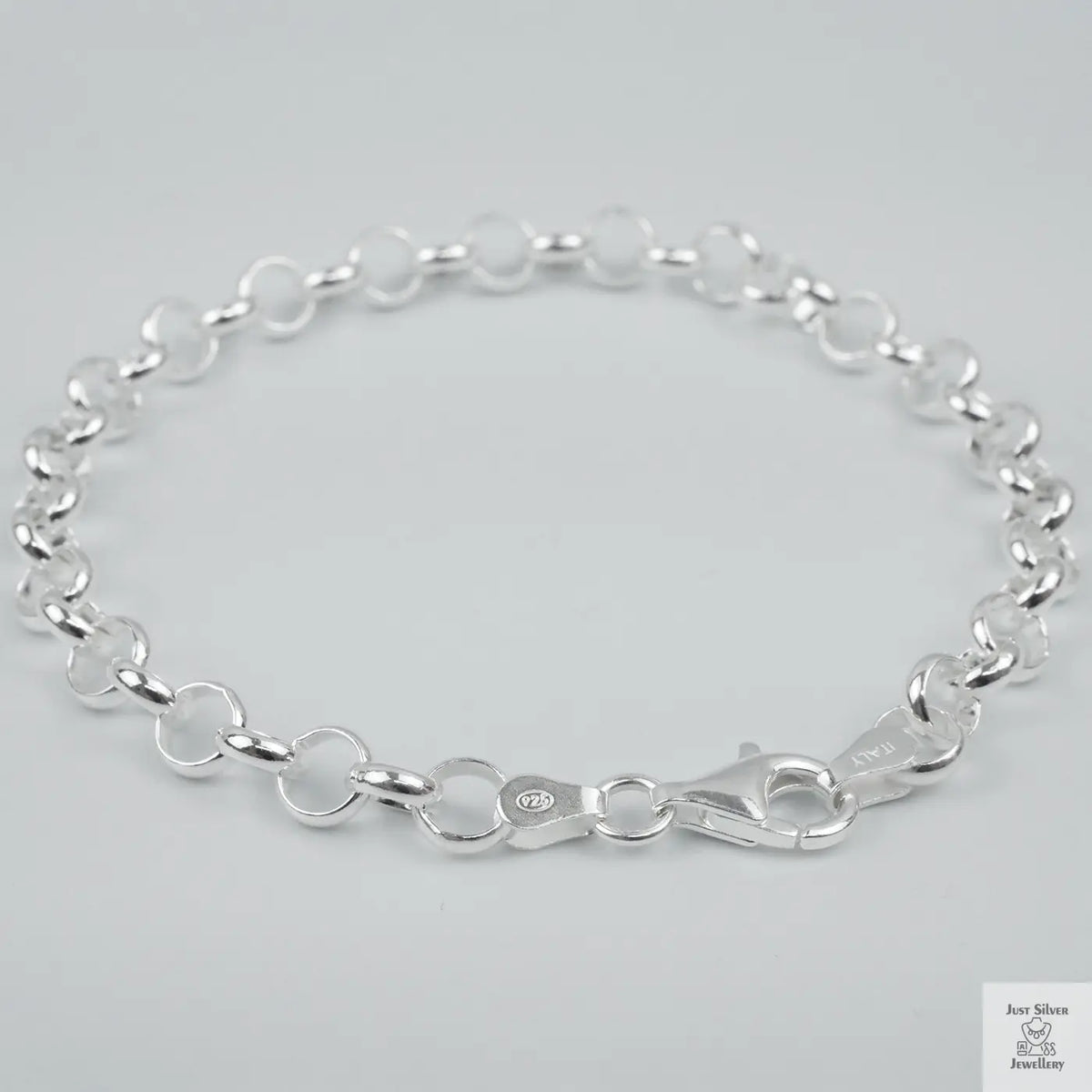 Silver bracelet on a light grey background