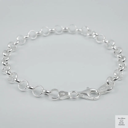 Silver bracelet on a light grey background