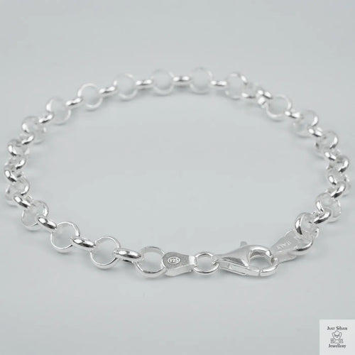 Silver bracelet on a light grey background