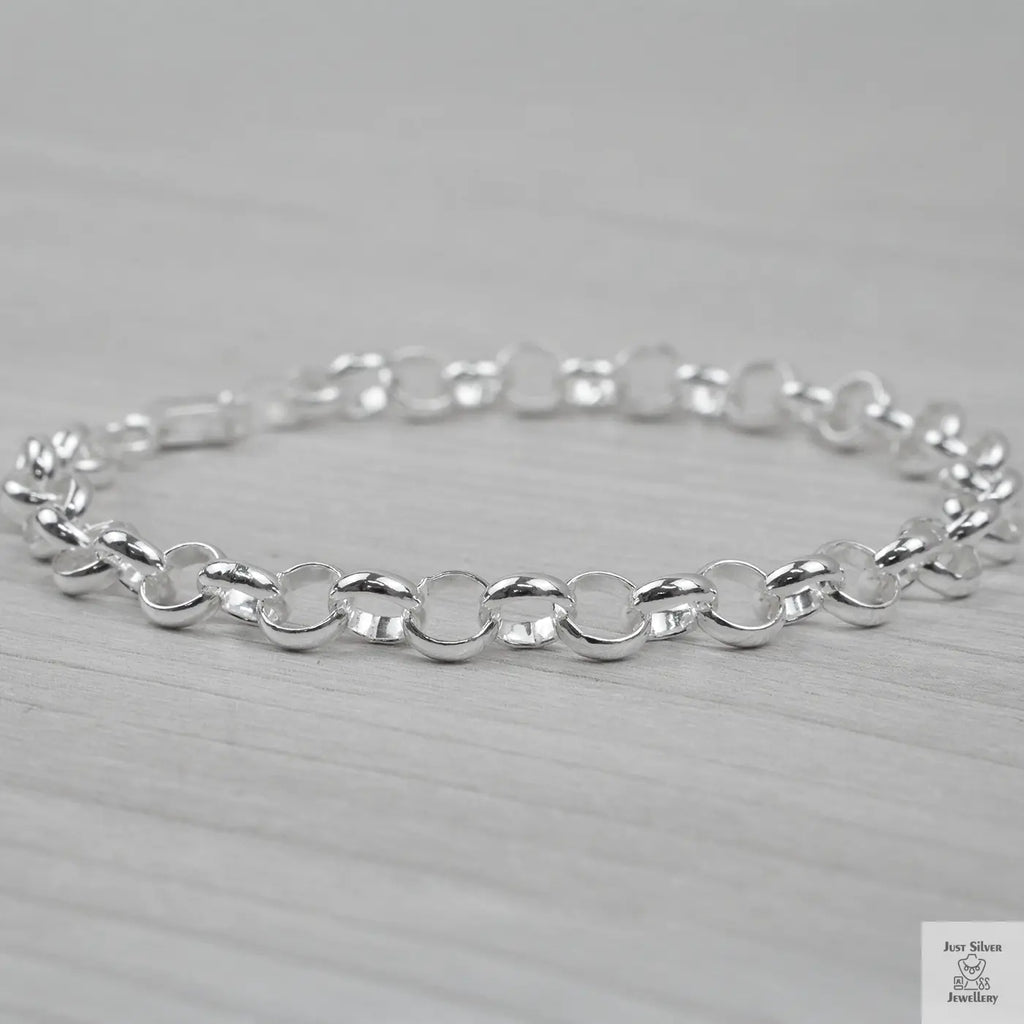 Silver bracelet on a light grey background