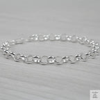 Silver bracelet on a light grey background