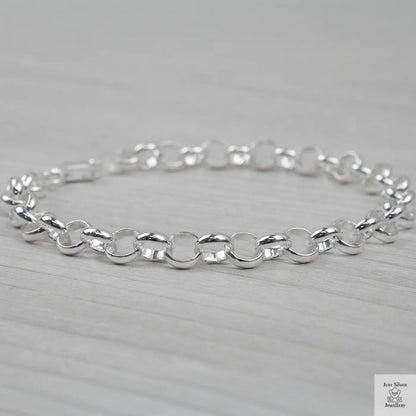 Silver bracelet on a light grey background