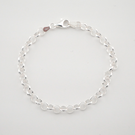 Silver bracelet on a light gray background