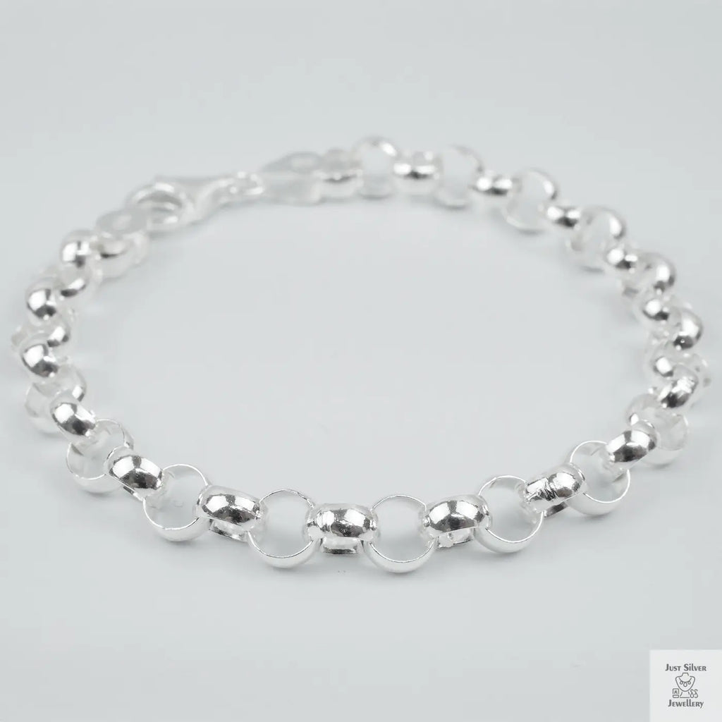 Silver bracelet on a light grey background