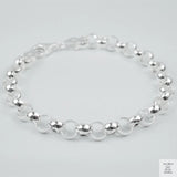 Silver bracelet on a light grey background