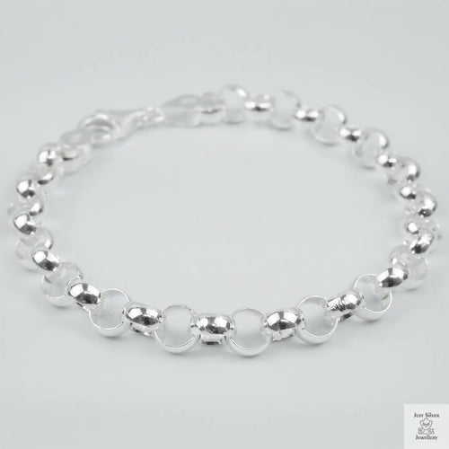 Silver bracelet on a light grey background