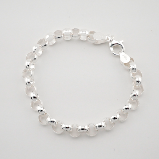 Silver beaded bracelet on a light gray background