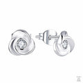 Silver earrings with clear gemstones on a white background