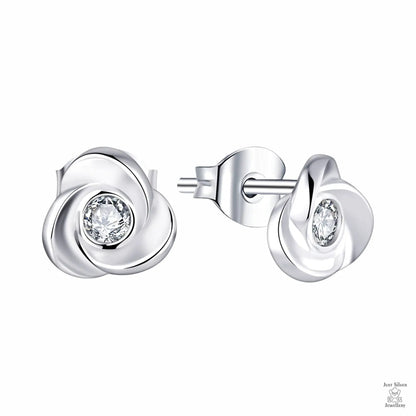 Silver earrings with clear gemstones on a white background