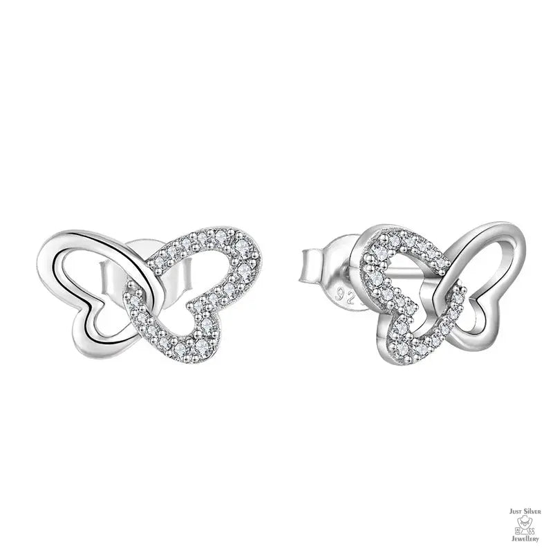 Pair of silver butterfly-shaped earrings with clear stones on a white background