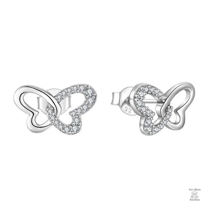 Pair of silver butterfly-shaped earrings with clear stones on a white background