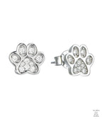 Silver paw print earring with small natural zircon gemstones on a white background