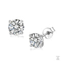 Pair of silver stud earrings with clear natural zircon gemstones on a white background