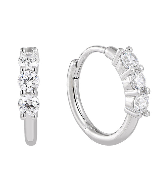 Silver hoop earrings with clear gemstones on a white background