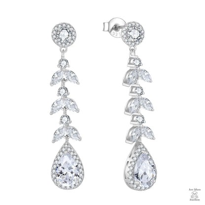Silver earrings with clear natrual zircon gemstones on a white background