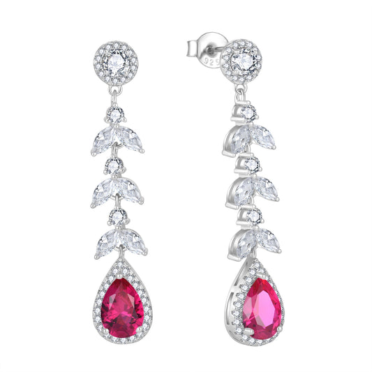 Pair of earrings with red teardrop zircon stones and leaves on a white background