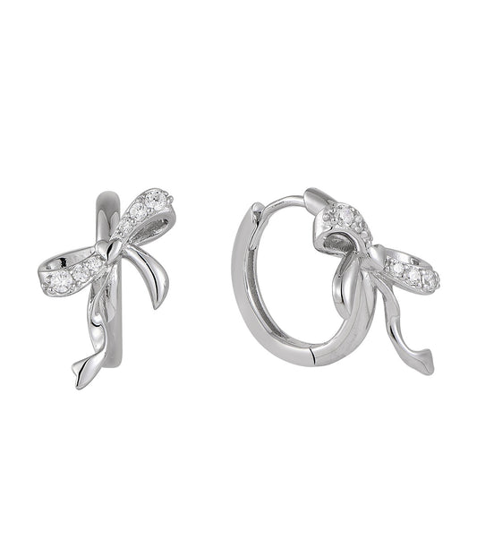 Silver bow-shaped earrings with clear zircon gemstones on a white background