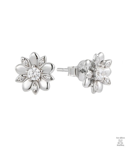 Silver flower-shaped earrings with natural zircon stones on a white background