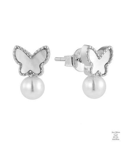 Butterfly-shaped earrings with pearl centers on a white background