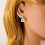 Close-up of a person wearing Natural Zircon earrings with blonde hair.