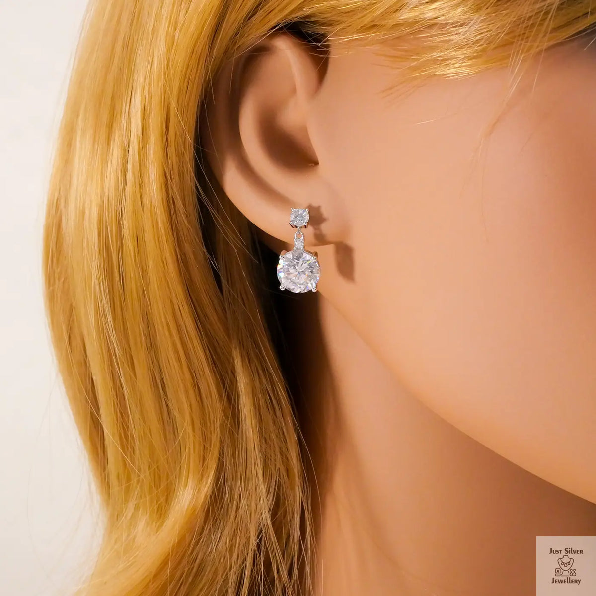 Close-up of a person wearing Natural Zircon earrings with blonde hair.