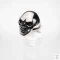 Silver skull ring on a white background