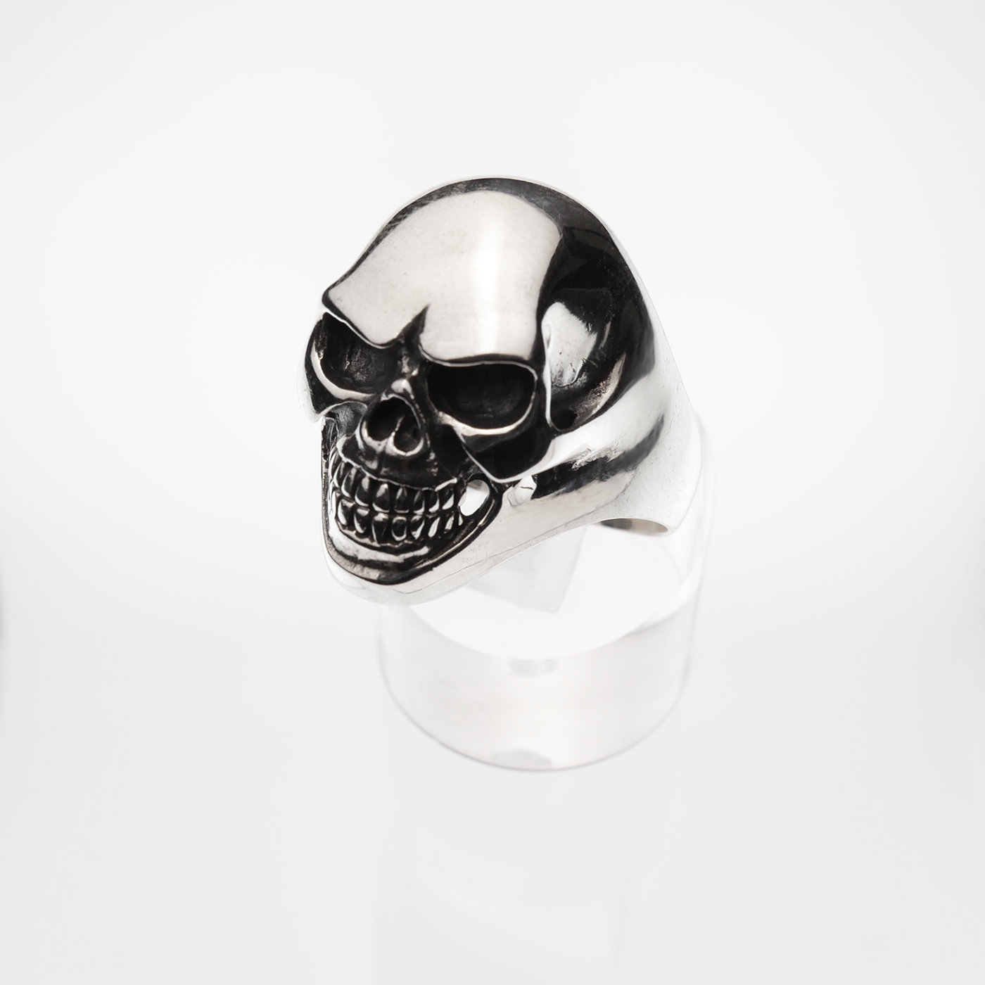 Silver skull ring on a white background