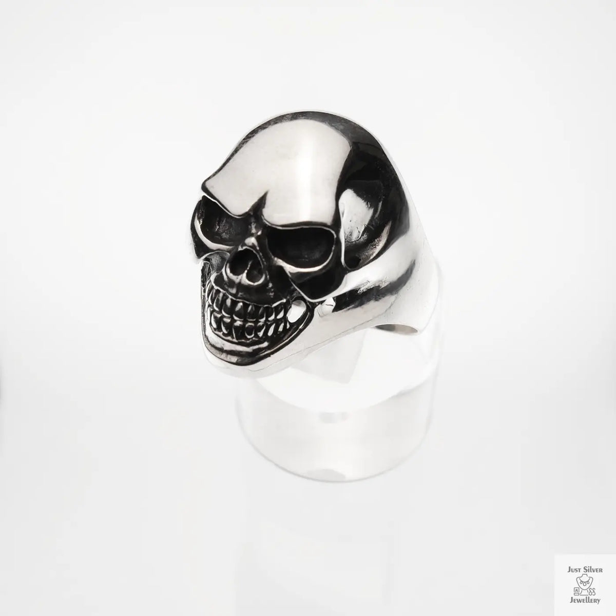 Silver skull ring on a white background