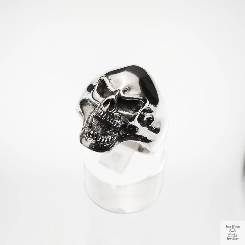 Silver skull ring on a white background