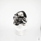 Silver skull ring on a white background