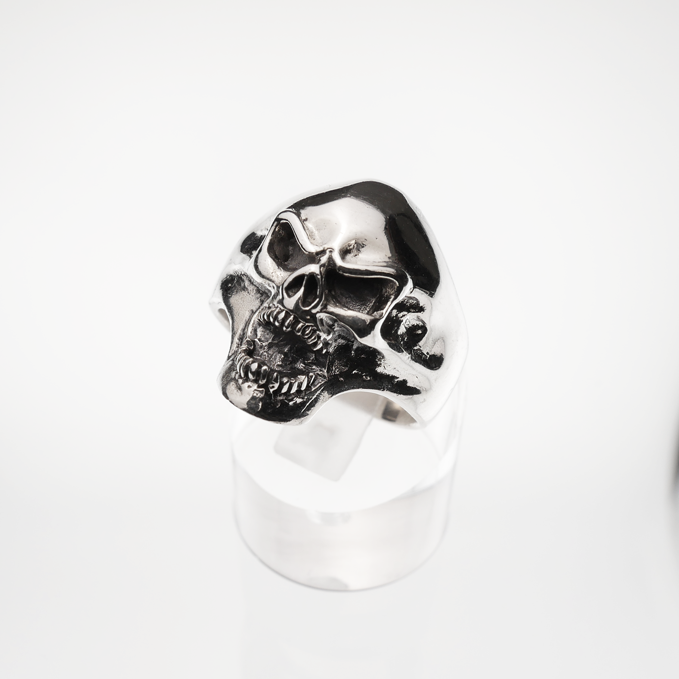 Silver skull ring on a white background