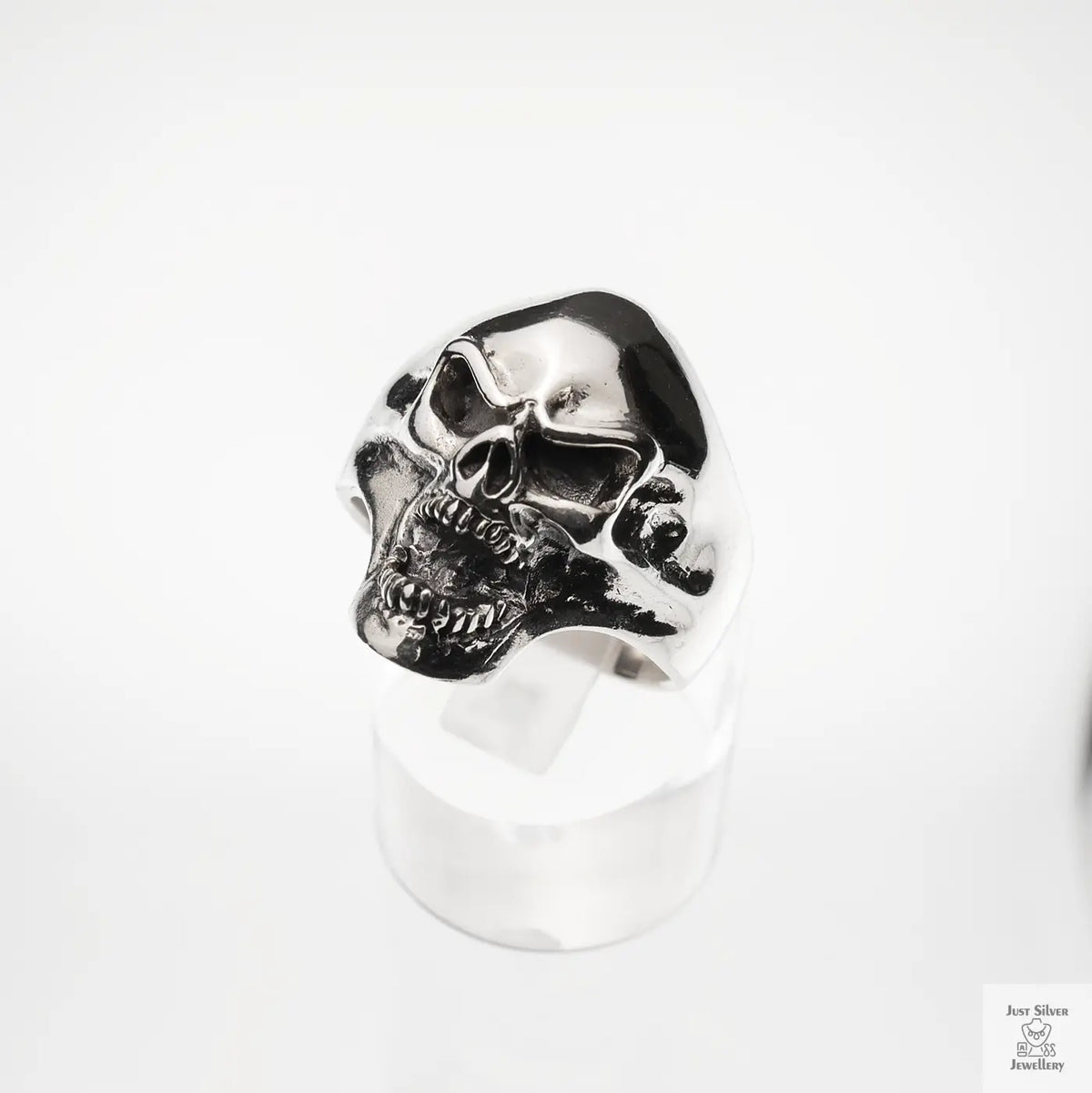 Silver skull ring on a white background