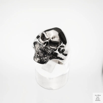 Silver skull ring on a white background