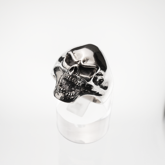 Silver skull ring on a white background
