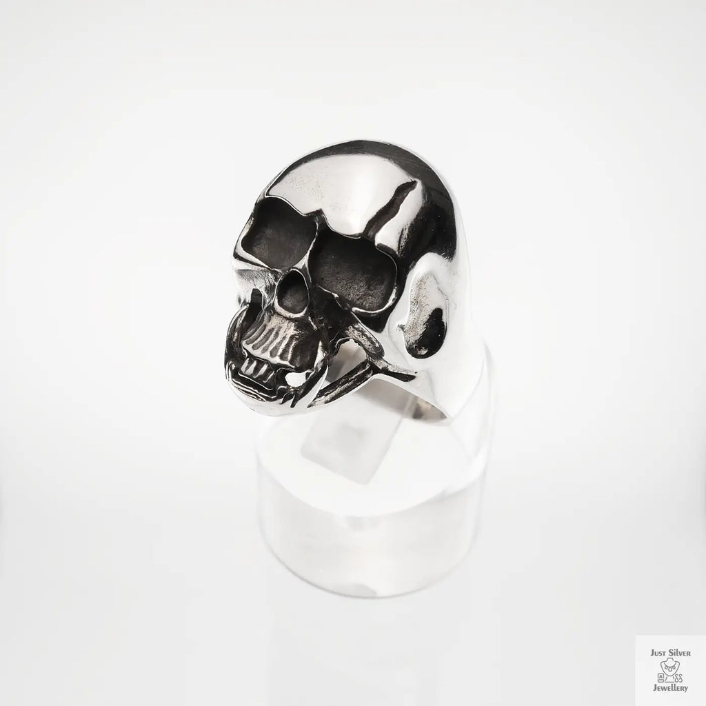 Silver skull ring on a white background