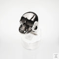 Silver skull ring on a white background