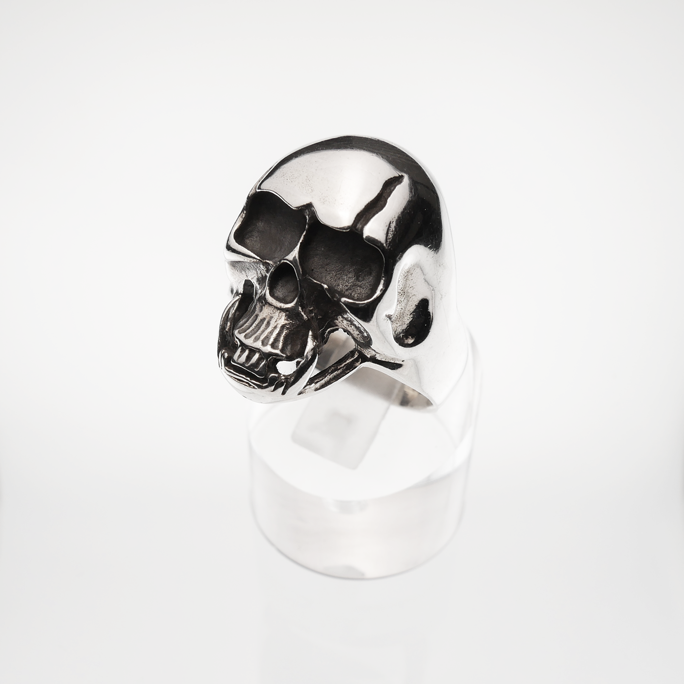 Silver skull ring on a white background